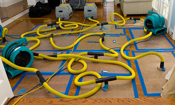 Professional Flood Damage Restoration technician working in Angier, NC